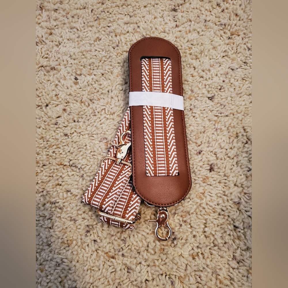 Brown and white bag strap